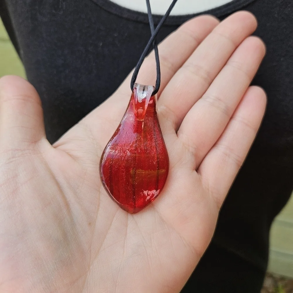 striped art glass pendant on black cord